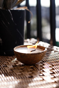 Candle in wooden Bowl